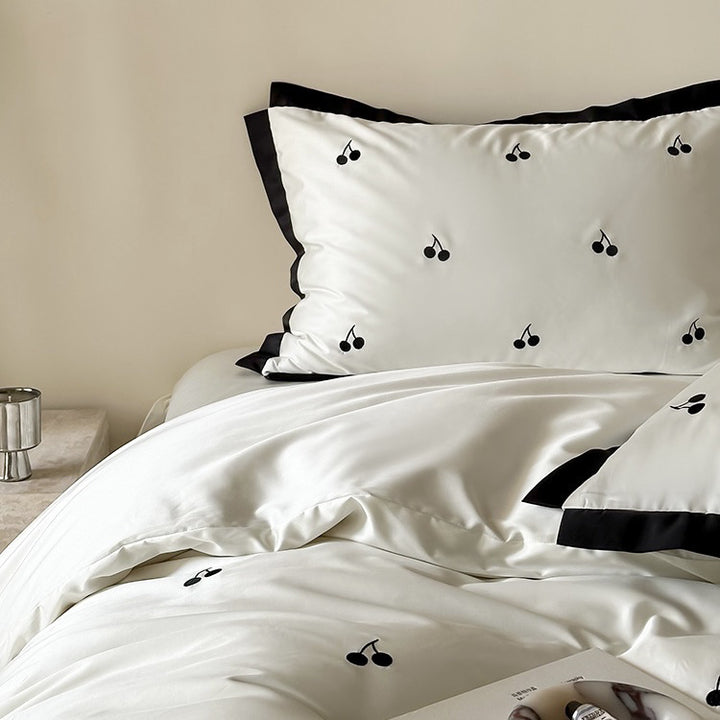 Luxurious satin bedding set with cherry embroidery and contrasting trim