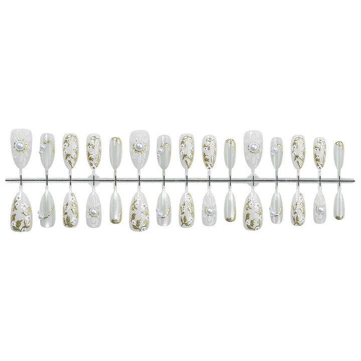 Acrylic nail set with elegant floral designs and glamorous glitter accents Kalsten