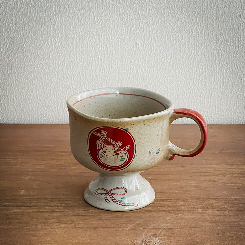 Ceramic foot mug with handle and hand-painted rabbit illustration
