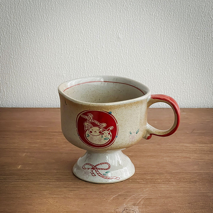 Ceramic foot mug with handle and hand-painted rabbit illustration