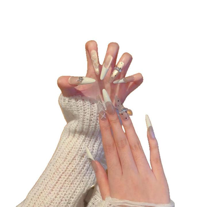 Elegant Stiletto Nail Extensions with Decorative Designs