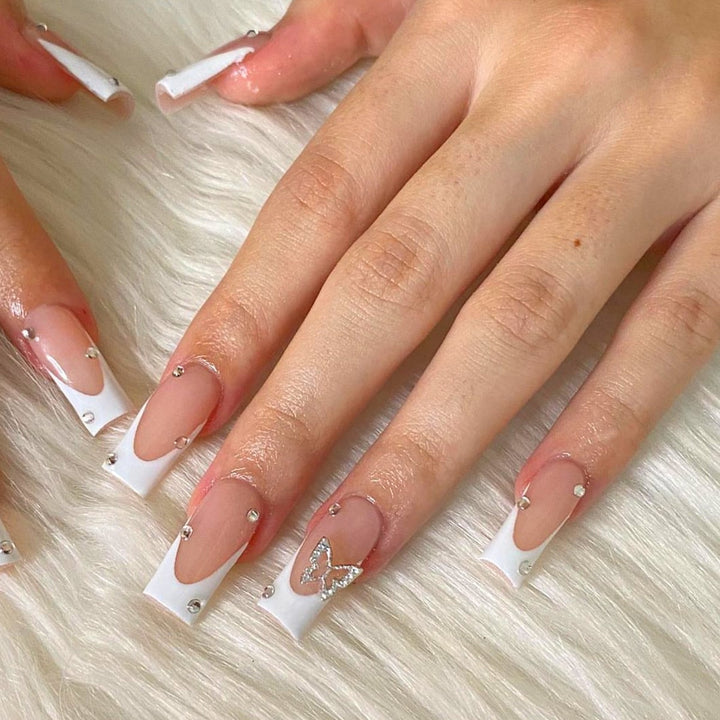 Artificial nails with elegant French tips and glitter accents Kalsten