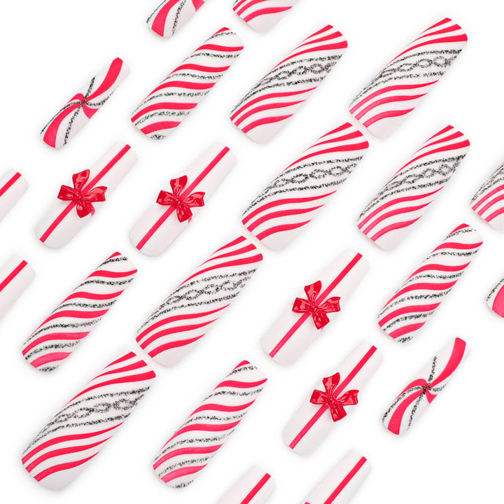 Artful Nail Art with Festive Bows and Christmas Motifs Kalsten