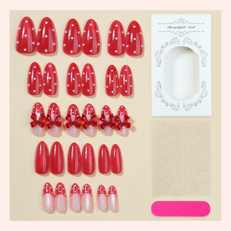 Nail art set with playful bow design and polka dot pattern Kalsten