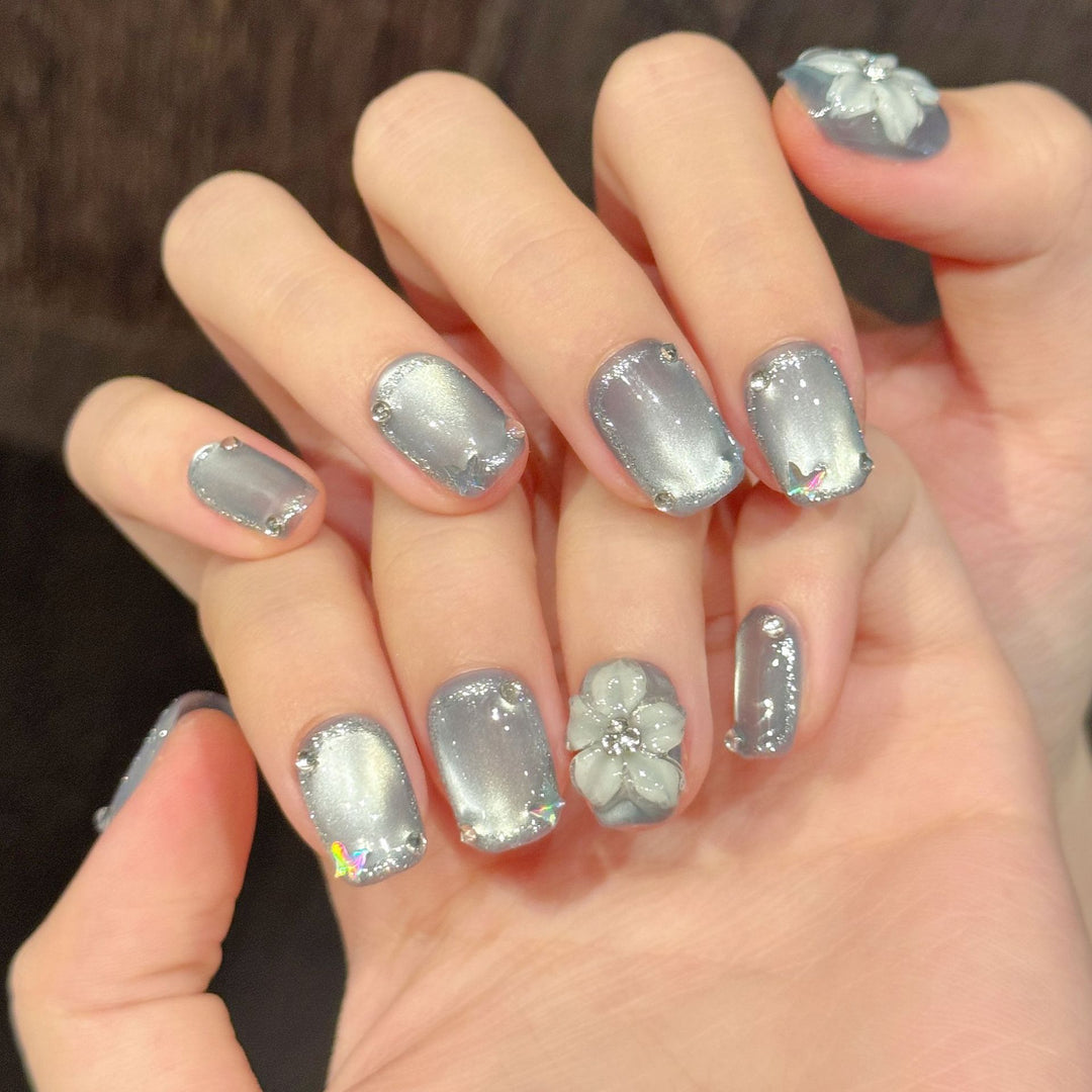 Artistic Press-On Nail Set with Floral and Rhinestone Accents