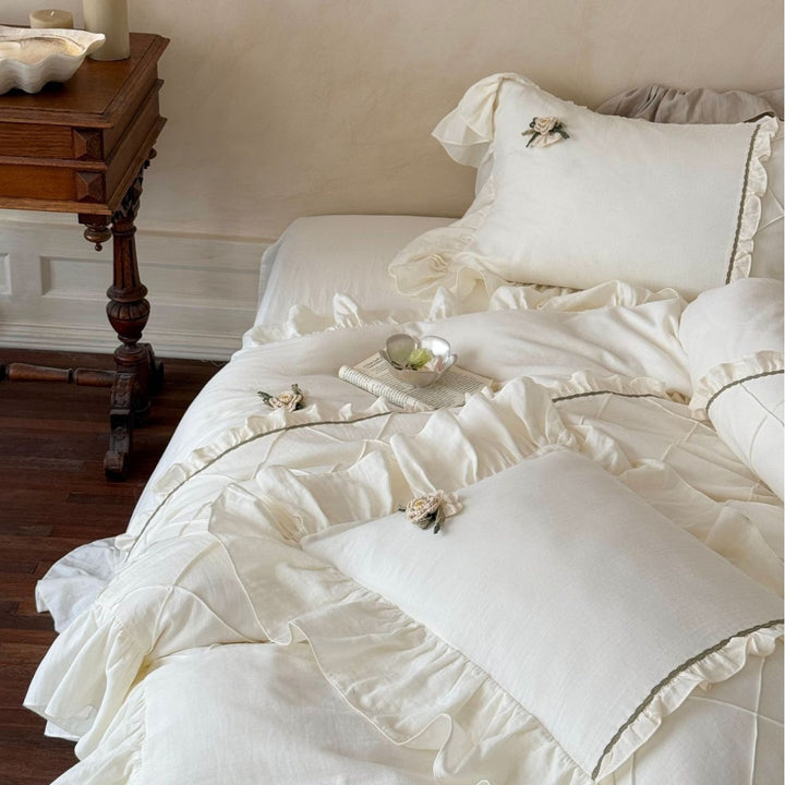 Country house style bedding set with quilted center piece, ruffle and rose appliqué