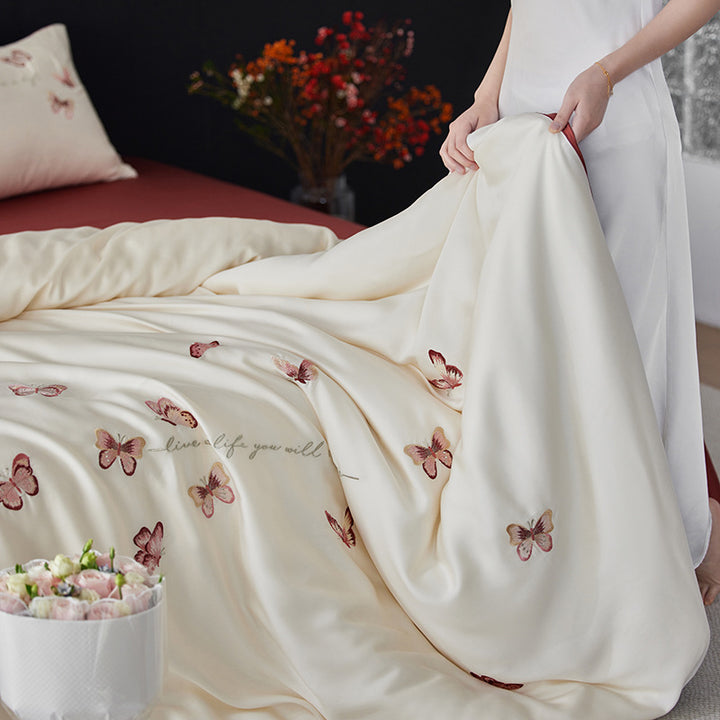 Luxurious cotton satin duvet cover set with embroidered butterfly designs and reversible design