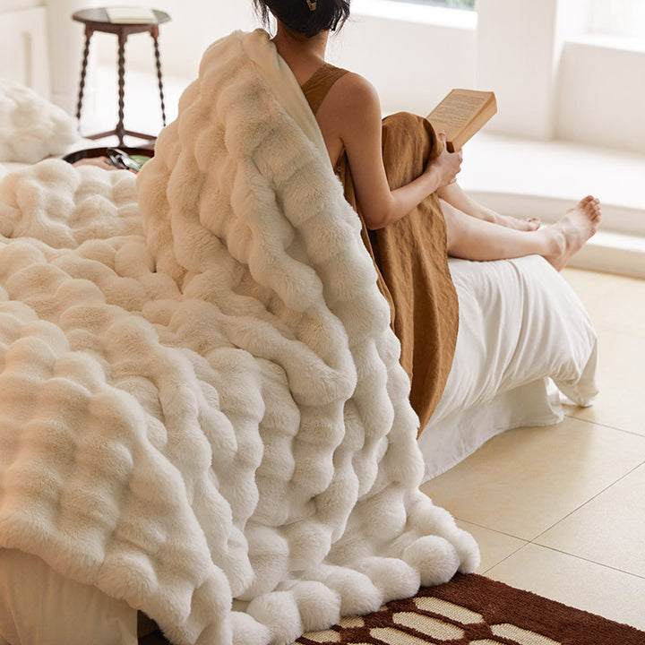 Cozy artificial fur throw blanket with wave structure and extra soft texture