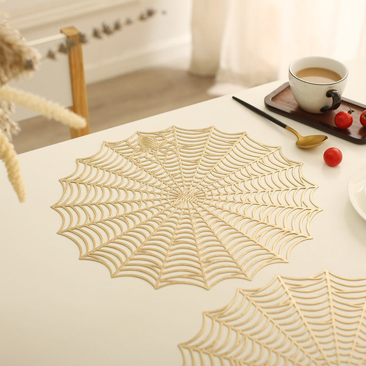 Round filigree spider web placemat made of heat- and water-repellent PVC for table decoration