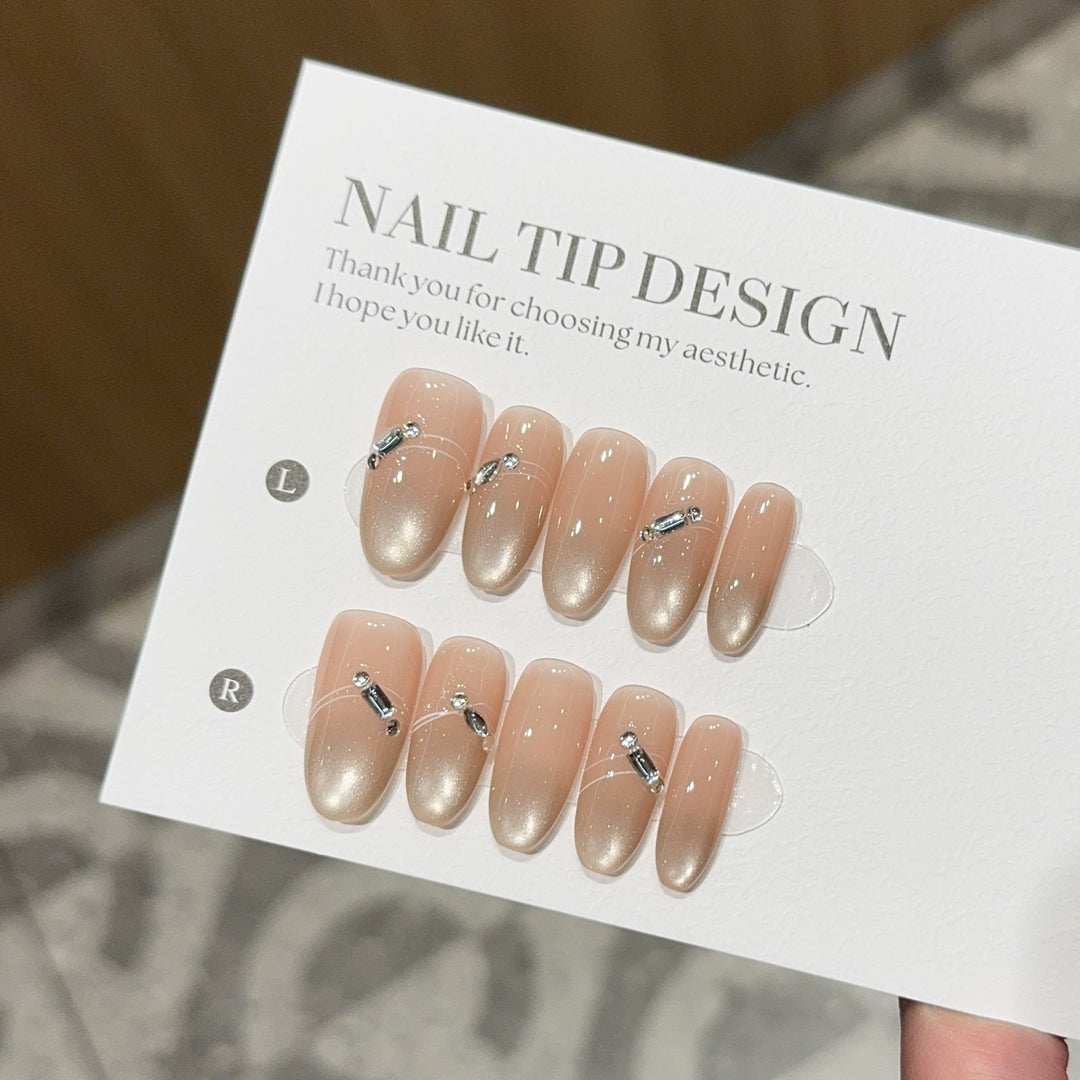 Artificial nail tips with elegant gradient color and rhinestone accents Kalsten
