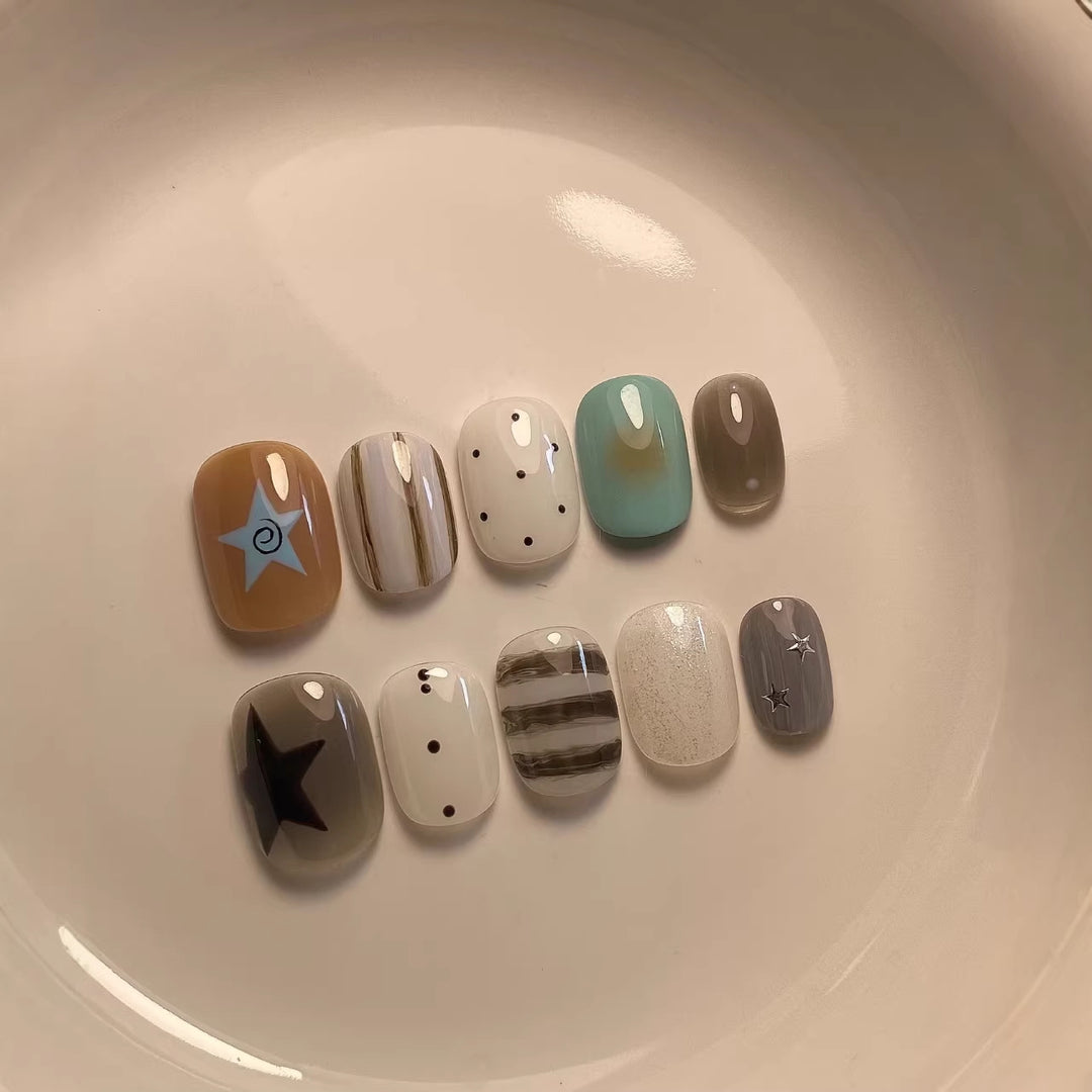 Artistic Press-On Nail Set with Geometric and Star Designs