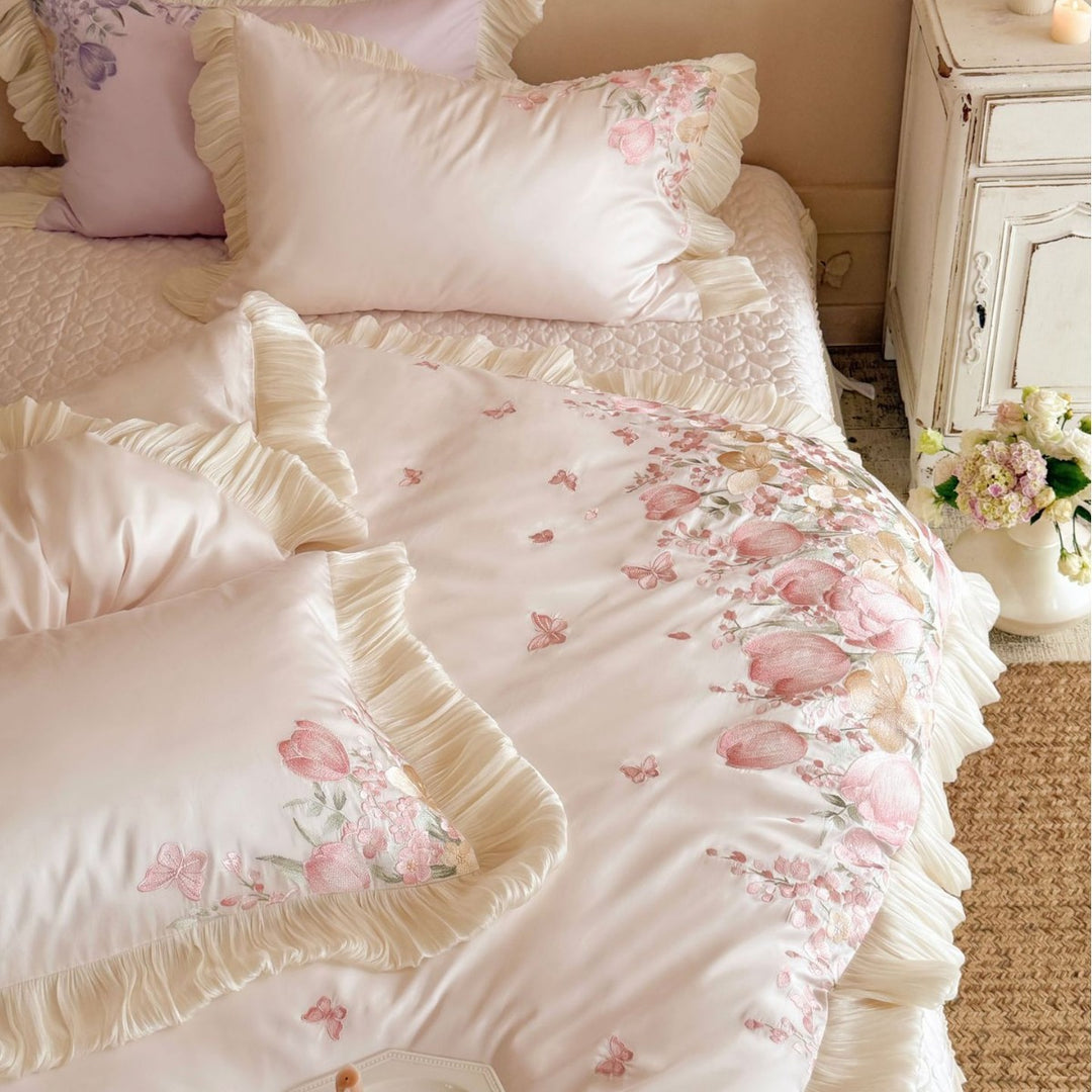 Luxurious embroidered satin bedding set with ruffles and floral details