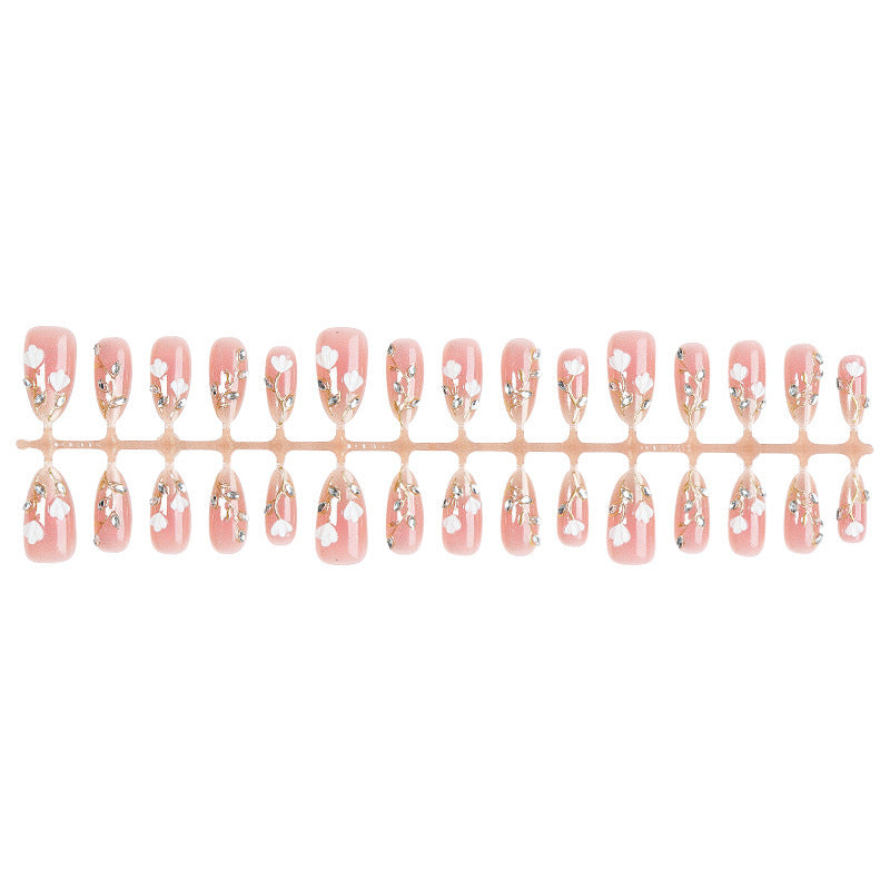 Artificial nail set with delicate floral patterns and elegant accents Kalsten