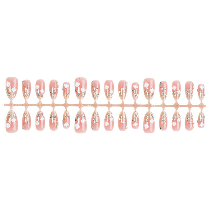 Artificial nail set with delicate floral patterns and elegant accents Kalsten