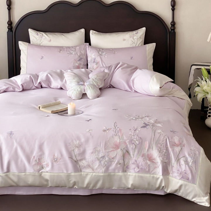 Luxurious satin bedding set with floral embroidery and butterfly appliqué