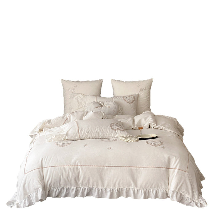 Romantic bedding set with ruffles, heart embroidery, and linen look