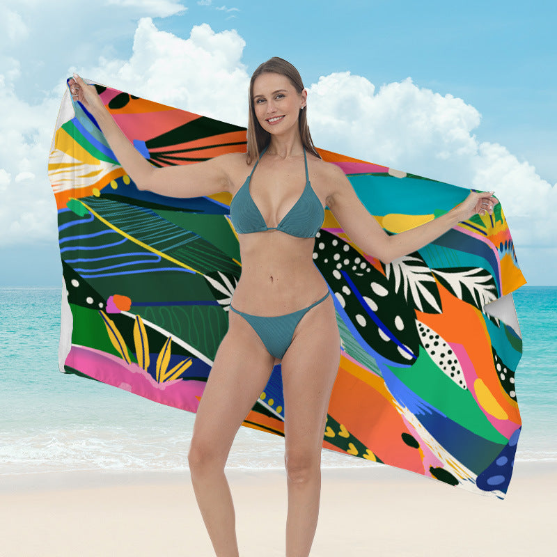 Beach towel with vibrant tropical plant motif Kalsten