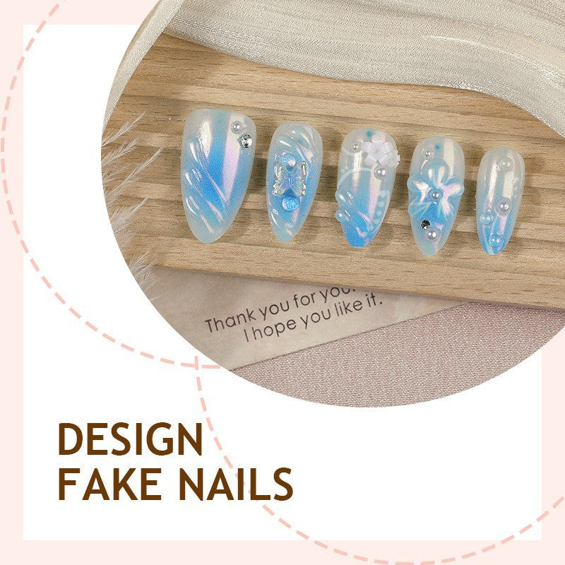 Artificial nail creation with floral designs and glitter accents Kalsten