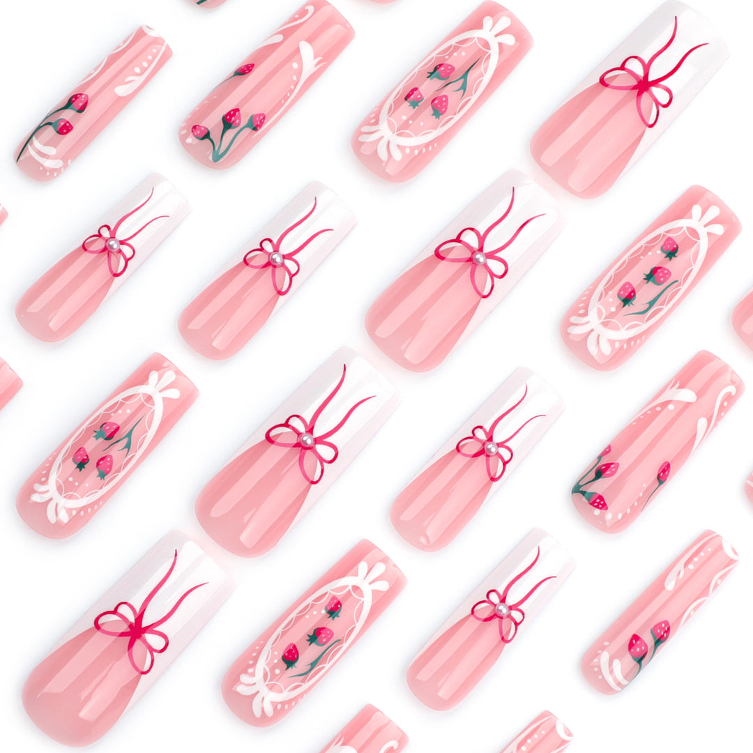 Artful nails with strawberry motifs and bow accents Kalsten