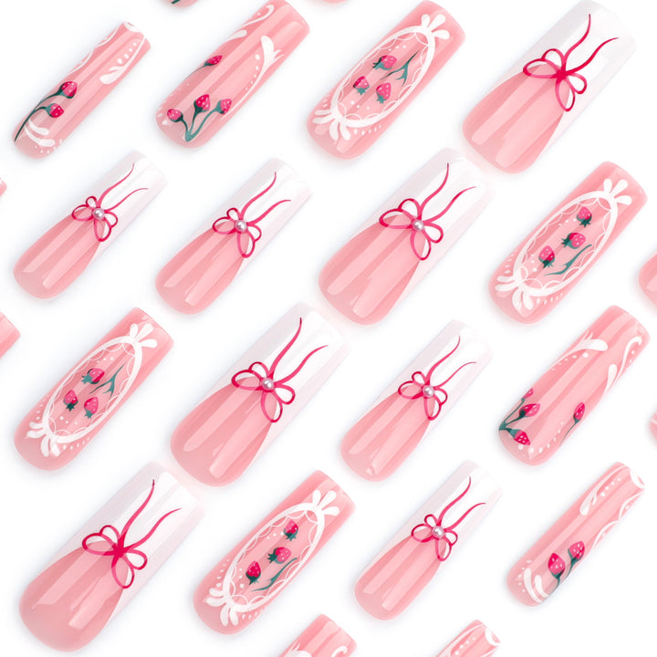 Artful nails with strawberry motifs and bow accents Kalsten