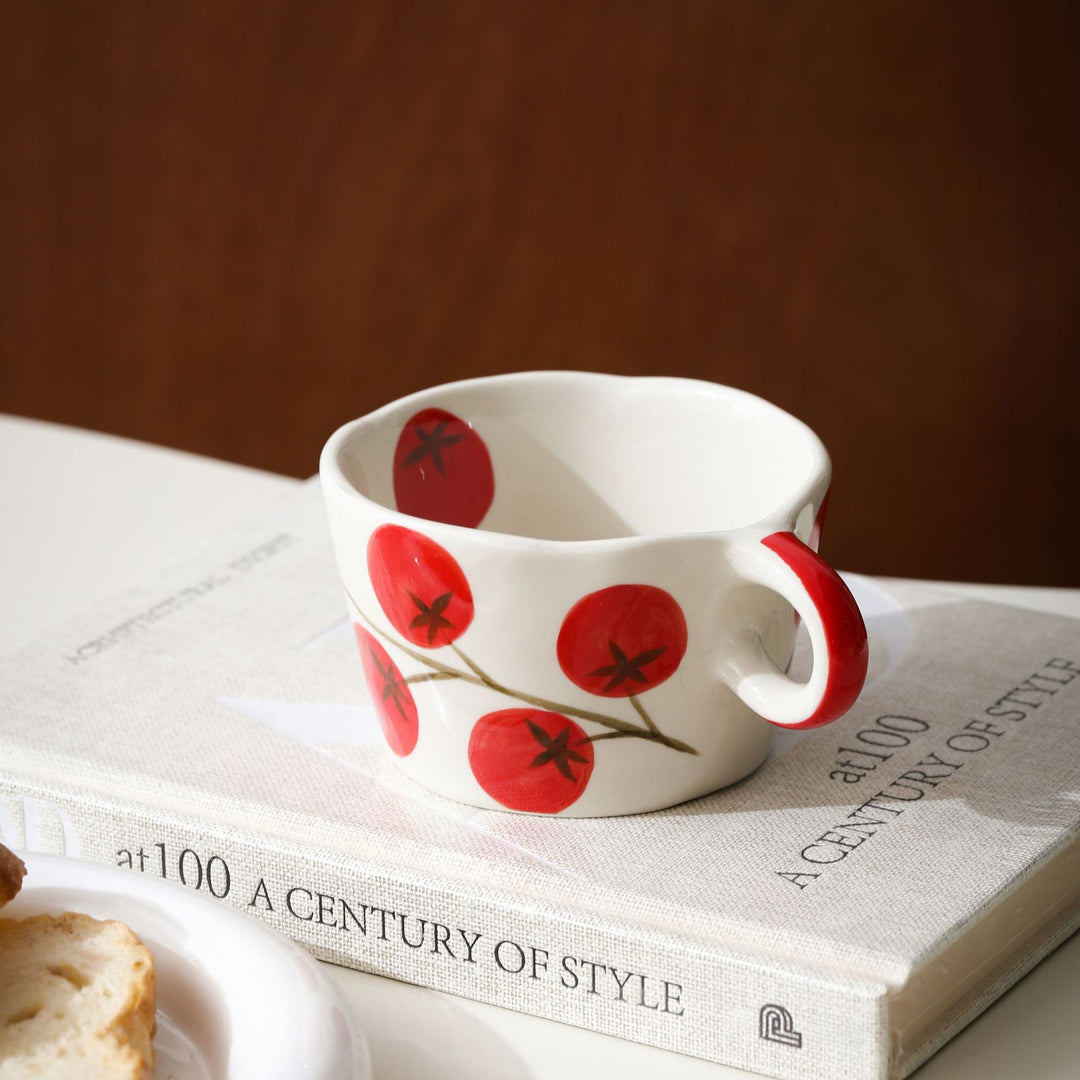 Ceramic mug with hand-painted banana illustration and round handle