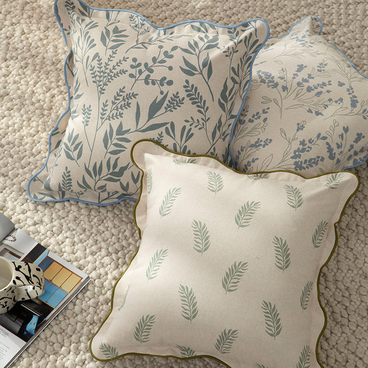 Decorative square decorative pillow with floral print, curved edge and removable cover