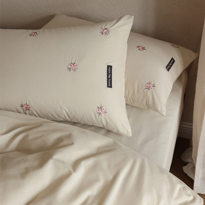 Embroidered cotton satin bedding set with subtle floral embroidery