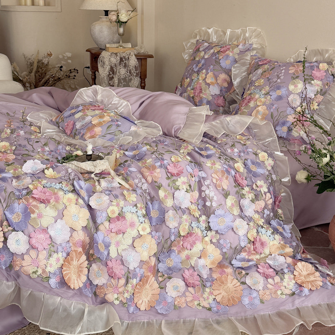 Embroidered bedding set with 3D flower application and ruffle hem