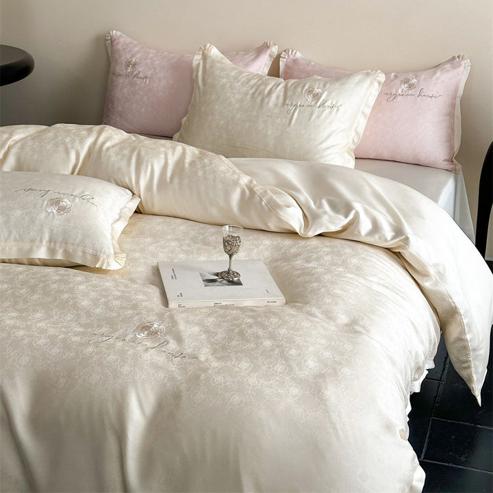 Luxurious cotton satin bedding set with jacquard relief and embroidered rose motif