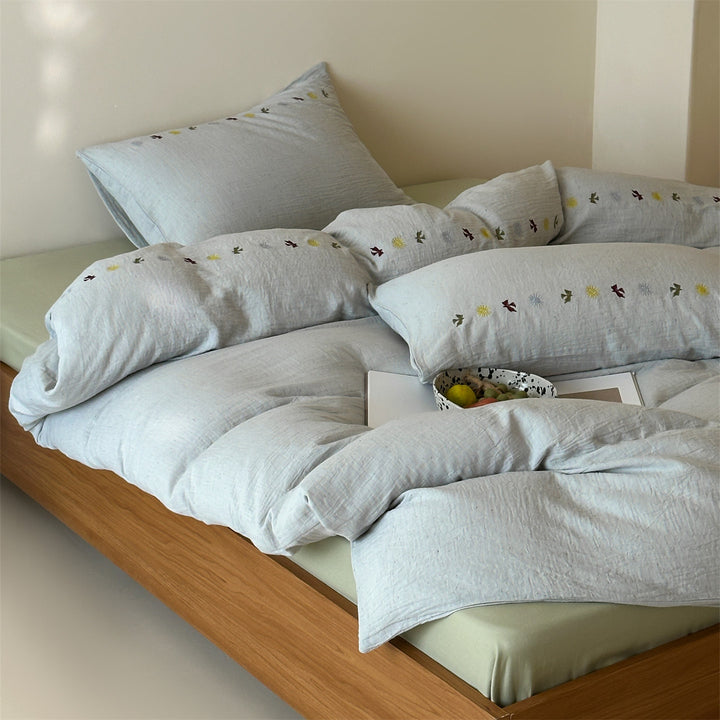 Bedding set in linen look with subtle embroidered border