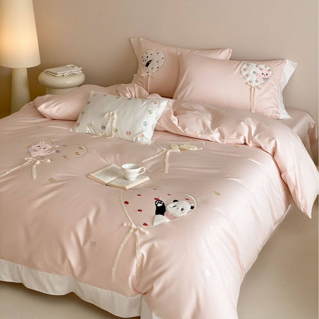 Romantic cotton bedding set with appliquéd heart balloons and plush motifs
