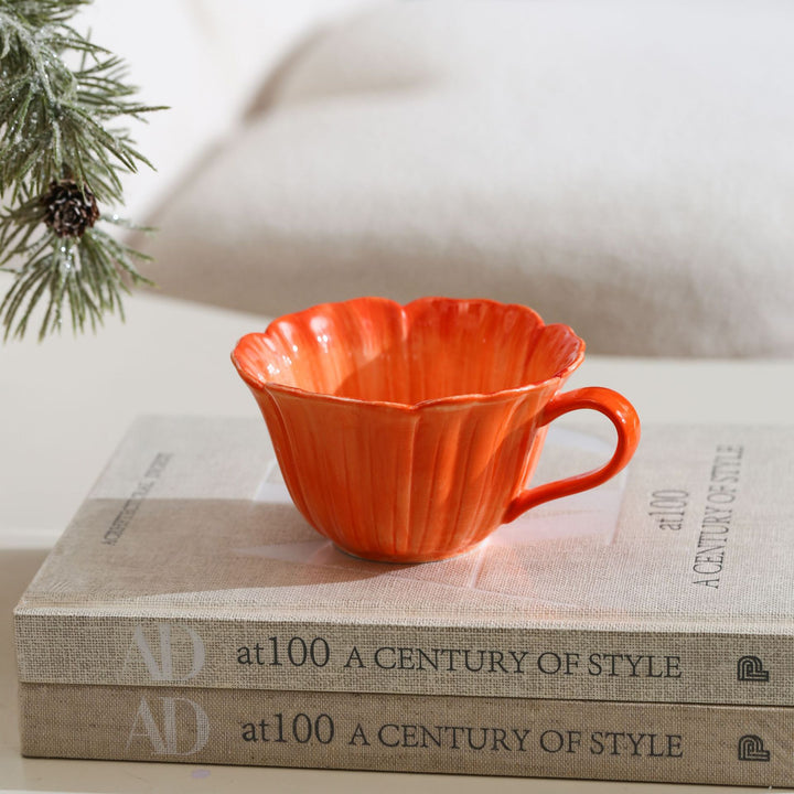 Ceramic mug with saucer in flower shape