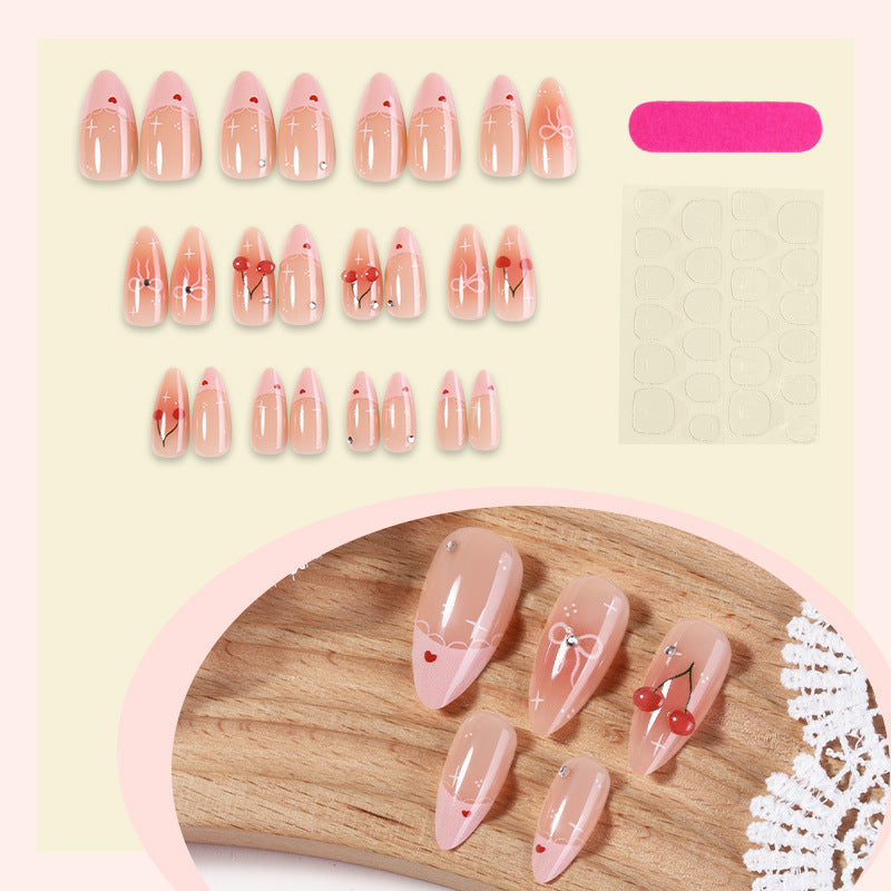 Artifical nails with playful heart and bow designs Kalsten