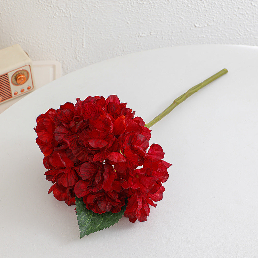 Artificial flower branch with realistic flowers