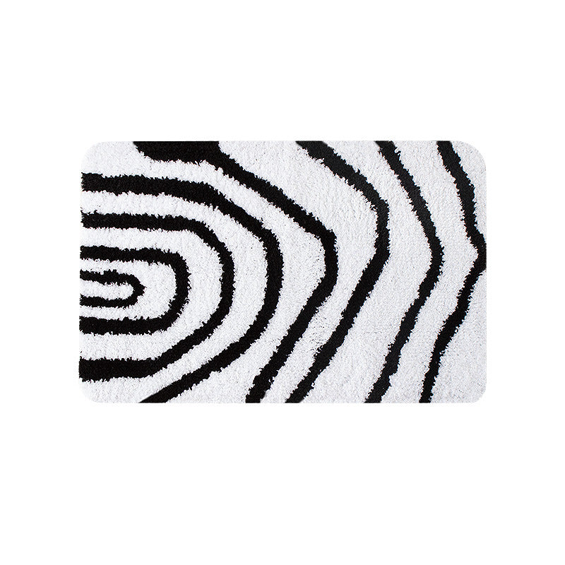 Fluffy bath mat in a graphic wave relief with anti-slip base Kalsten