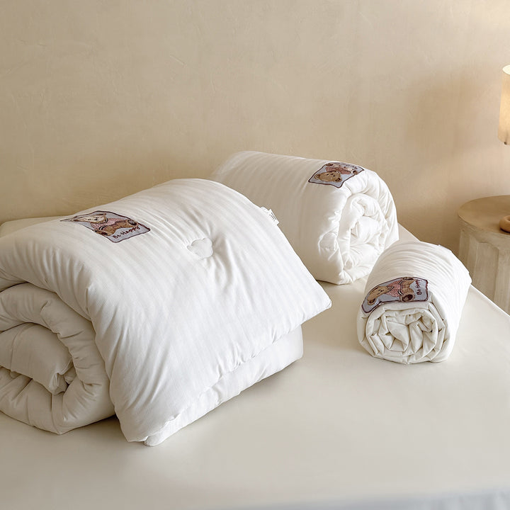 Quilted duvet with teddy applique and breathable microfiber filling