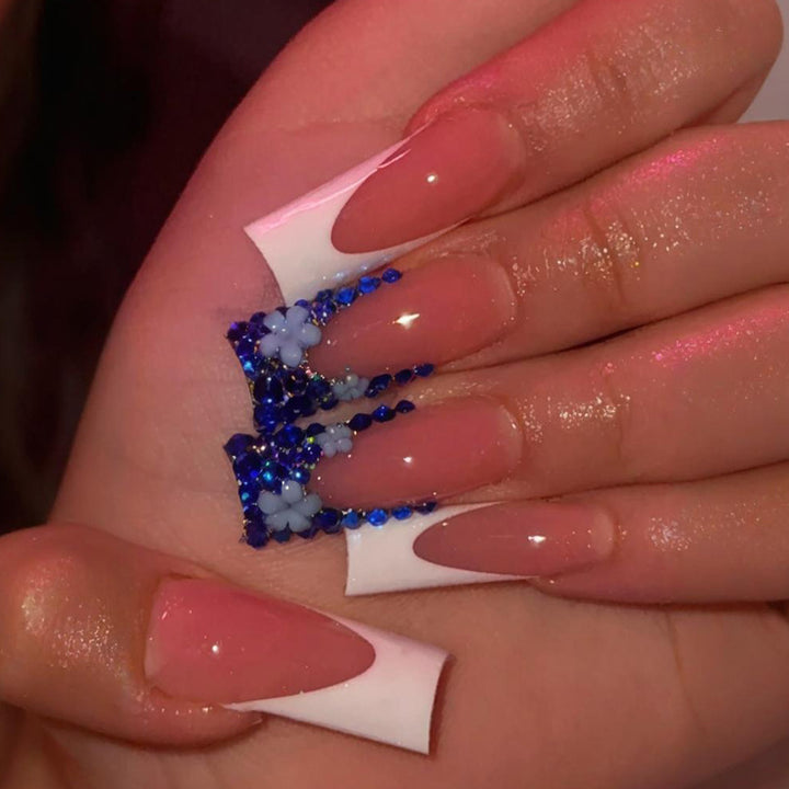 Artificial nail design with trendy blue accents and glitter coating Kalsten