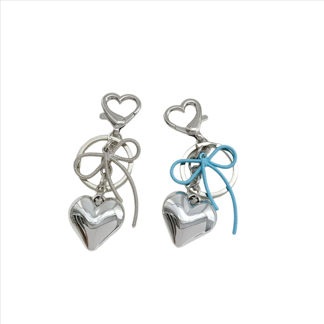 Heart-Shaped Metallic Keychain with Decorative Bow Kalsten