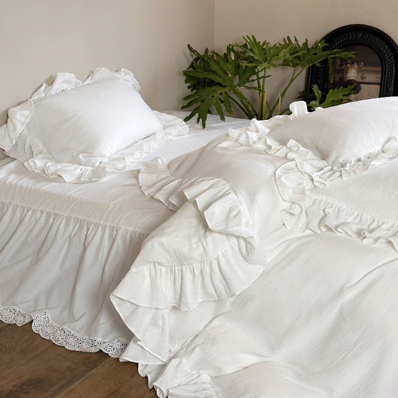 Romantic bedding set with voluminous ruffle, lace bed skirt, and double-layered frills