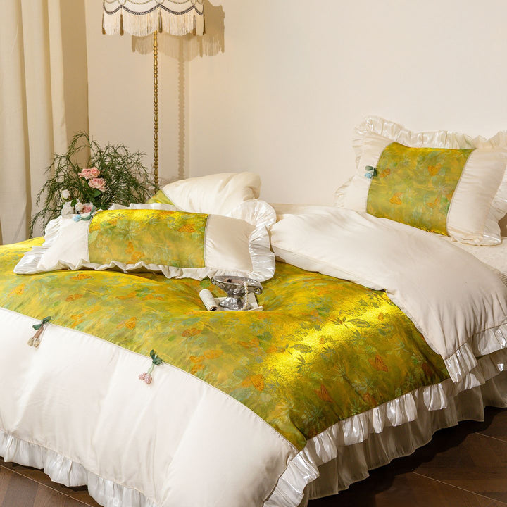 Bedding set with ruffles, satin trim and floral center panel
