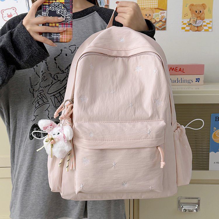 Playful backpack with fine embroidery Kalsten
