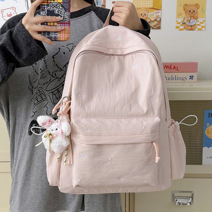 Playful backpack with fine embroidery Kalsten