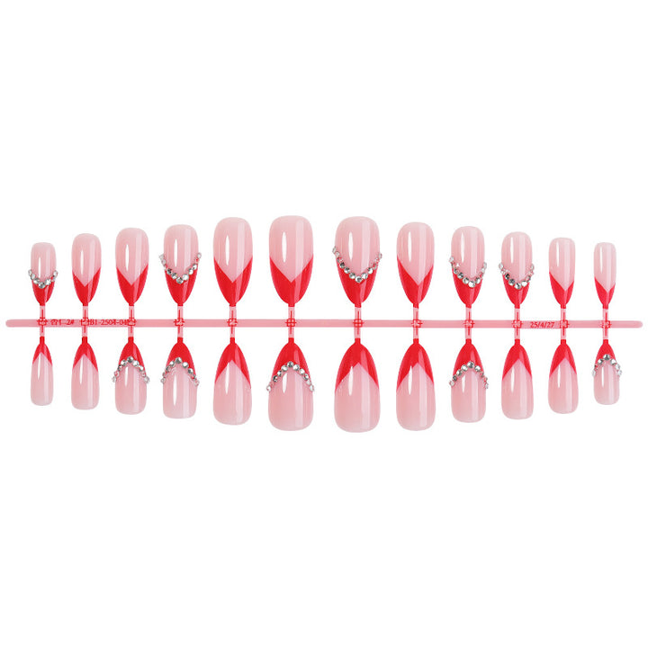 Nail art set with elegant red accents and rhinestone embellishments Kalsten