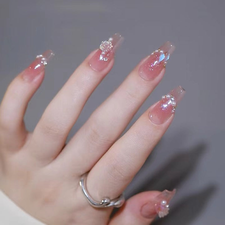 Artificial nails with heart design and glitter accents Kalsten