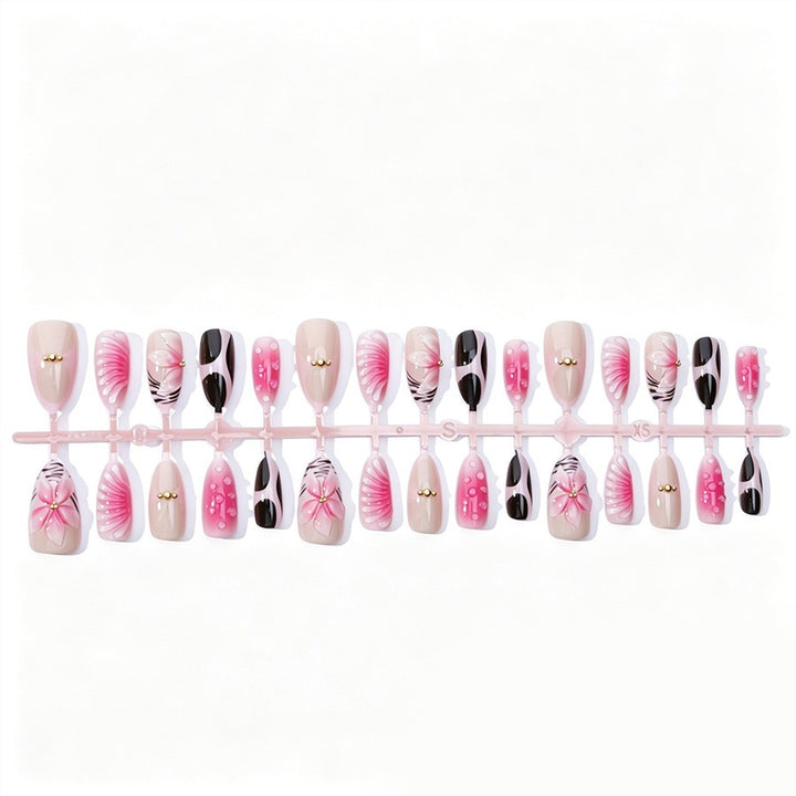 Acrylic nail set with filigree flower and glitter accents Kalsten