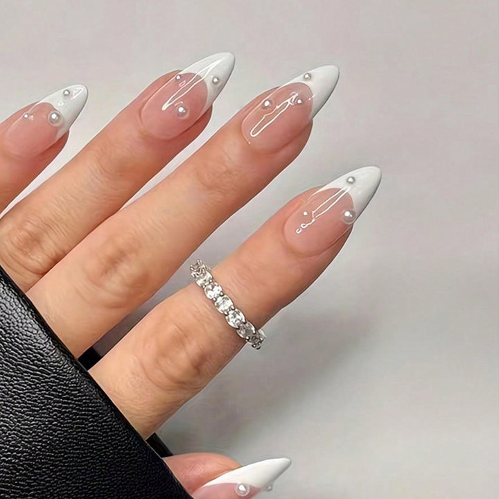 Artificial nail set with elegant French tip and shimmering pearl accents Kalsten