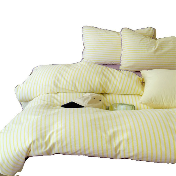 Striped cotton percale bedding set with contrasting decorative piping