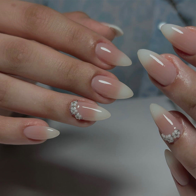 Acrylic nail set with elegant French tip and extravagant decorative details Kalsten