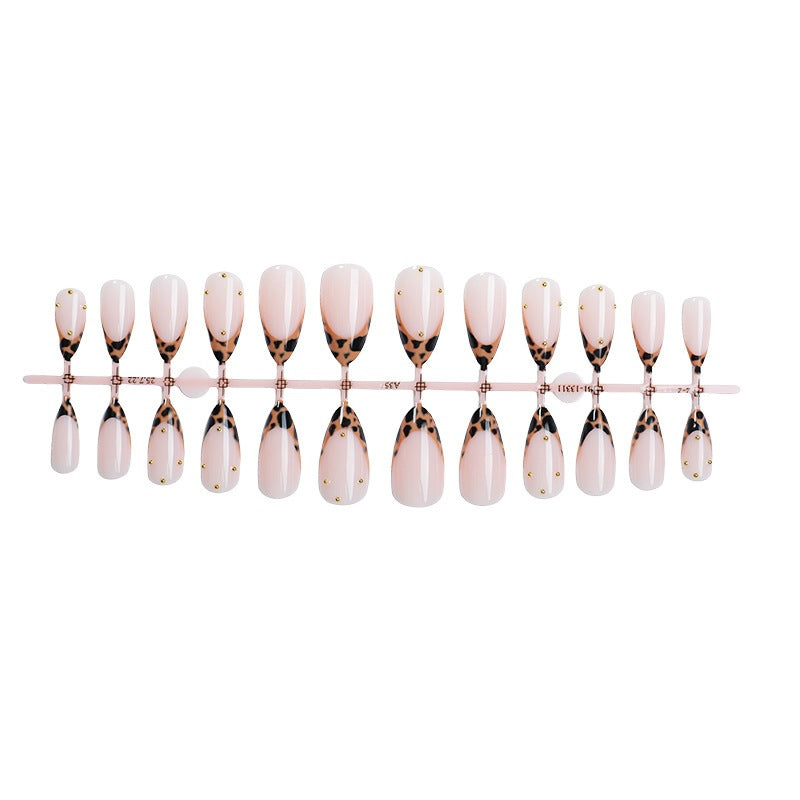 Acrylic nail set with elegant leopard design and gold accents Kalsten