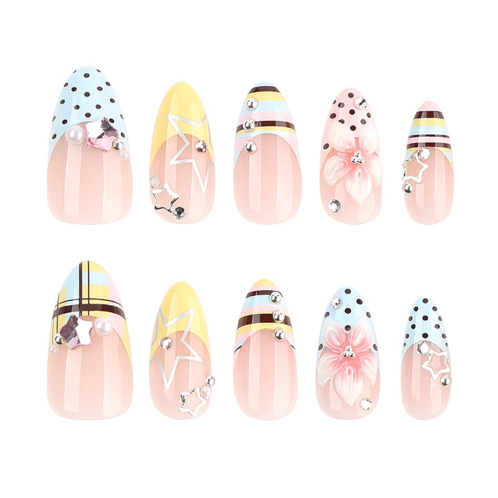 Creative nail designs with floral accents and glitter Kalsten